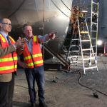 Guy and Tom Barwick look on as a boat is built at Hayward's Western Junction Plant